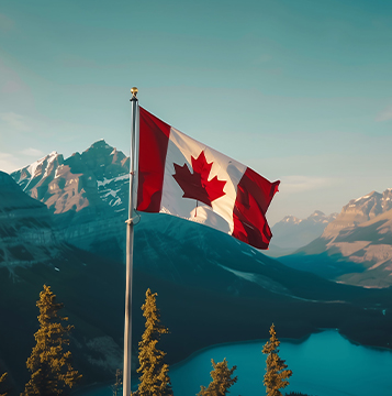 canadian-flag-waves-against-a-backdrop-of-mountains